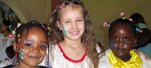 Alina (5) and two young girls after a Christmas show in Zambia