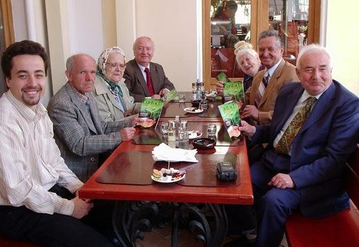Senior citizens in Romania enjoying a Family-sponsored birthday lunch