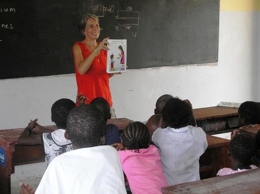 Clotilde using flash cards to teach the children biblical values