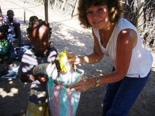 Mylene distributing food to orphans