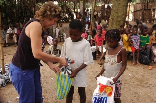 Mylene distributing food to orphans