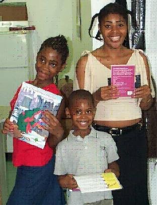 Maggie & children--feeling very grateful and loved by The Family for the donation of books.