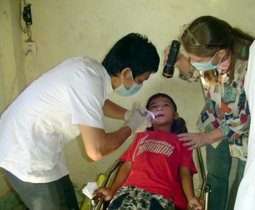 A Cambodian child receives free dental care