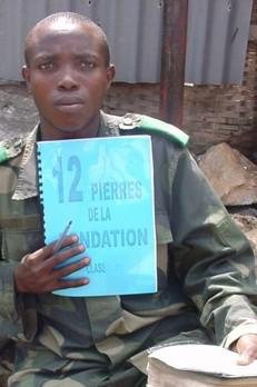 Alain with his 12 Foundations Stones study book.