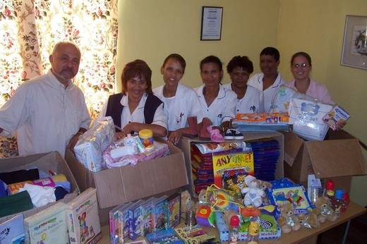 Helping Hand, Cape Town: Anthony Kristina and Sarah with donated toys and education materials