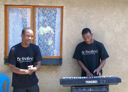 Associate members of the Family International giving a speech and providing the music