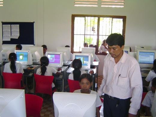 Children in Cambodia receiving computer classes