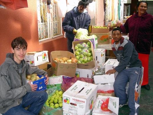Helping Hand, Cape Town: Christopher with food for the poor