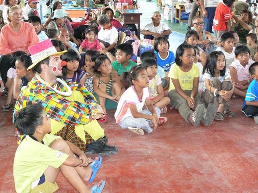 Family volunteer David, reaching out to comfort children affected by Typhoon Morakot, Taiwan