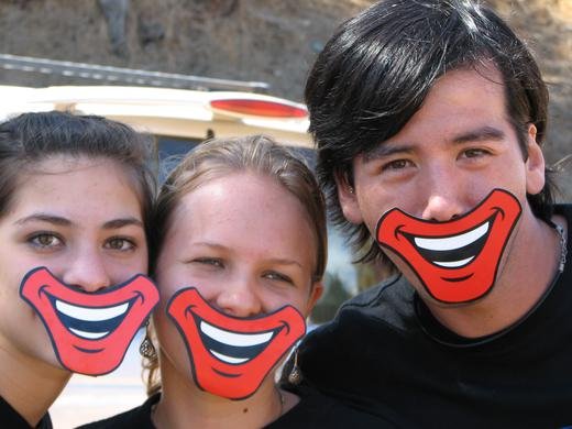 Family volunteers Marise, Tere, and Jose putting on their smiles