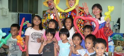 Family volunteers encourage children affected by Typhoon Morakot in southern Taiwan