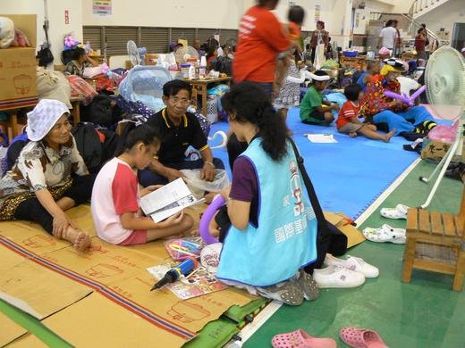Hannah uses children's activities to comfort and encourage a devastated family in Pingung, Taiwan
