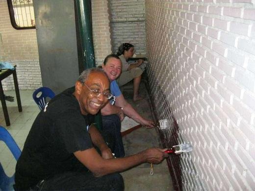 TFI members John and Sarah helping to paint at the Suan Dek Development Center