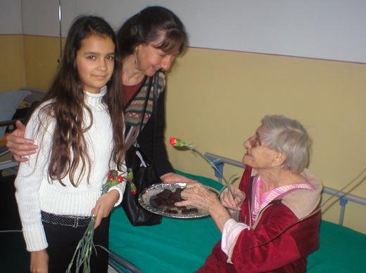Julia [13] & Hannah cheering an elderly lady at the St Luca hospice, Bucharest