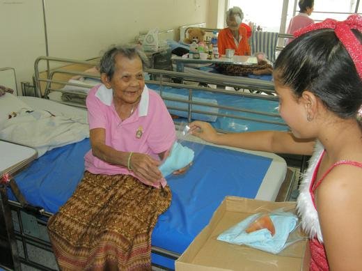 Lina passing out gifts at the Bahn Bang Kae Senior Citizens Home