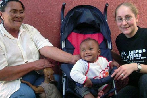 Lisa with a happy grandma and new stroller for the baby