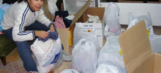 Luminita_preparing_packages_for_an_event_for_100_poor_families_Romania.JPG