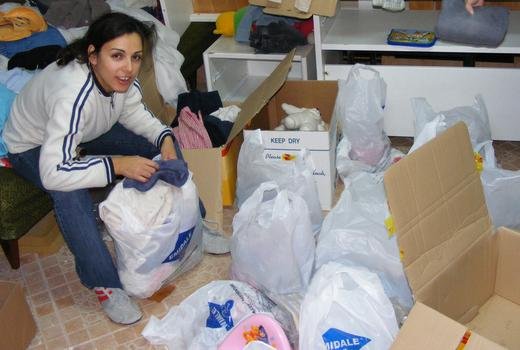 Luminita preparing packages for an event for 100 poor families, Romania