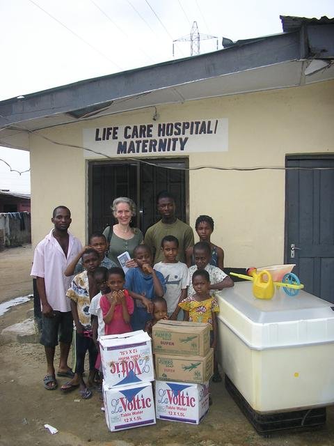 Maria with orphans at the “Life Caring Orphanage”