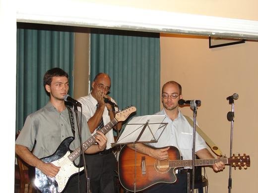 (L-R) Martin, Simon, and Jan performing “Happy Birthday Jesus”