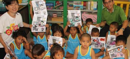 Mary_Paul_with_kids_art_at_the_slum_daycare_center.jpg