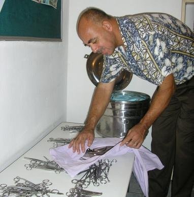 Volunteer Simon sterilizing instruments 