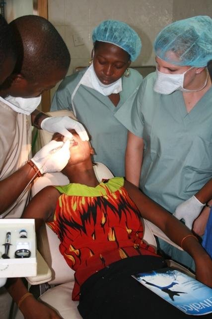 Patient receiving dental treatment at a free dental program at the Family Care Ikota Clinic