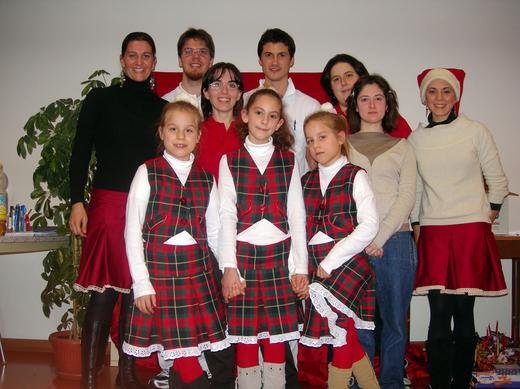 Petra (far left), Kaycee (far right), (front L-R) Erica (8), Aysu (9), and Bianca (8) with the grateful staff of a retirement home where they performed, Italy