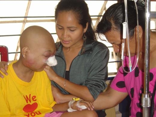 Clarisse & Faith pray for a cancer patient
