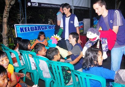 TFI volunteers, Kevin, Ben, and Joe with their puppets bringing happiness and hope to displaced children.