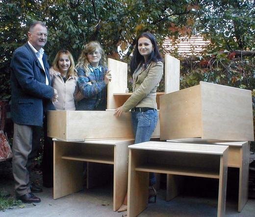 Jewel, Family volunteer, with the directors and one of the teachers of the kindergarten that received the donation of desks and beds