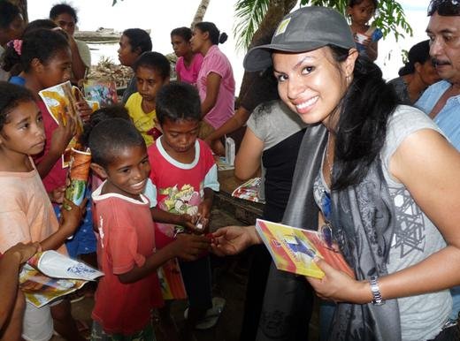Sharon, a volunteer with TFI, distributing educational supplies to children in the Maluku Islands, East Indonesia