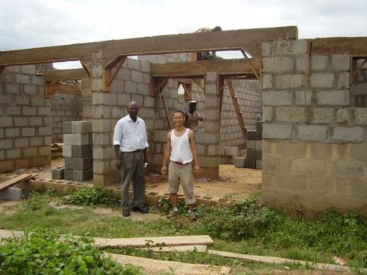 Project Manager Simon Danmola and volunteer at the IT training center construction site, Nyanya, Nigeria