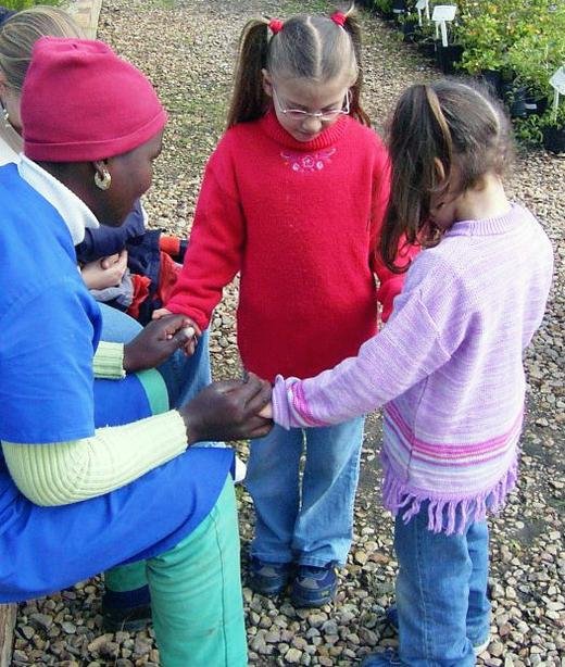 Helping Hand, Cape Town: Stef and Amy pray with a worker