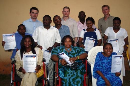 Graduates of a Family-sponsored computer training center in Nigeria proudly hold their certificates