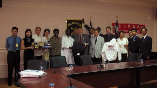 Press conference attendees, July 18, 2003. (Left to right:) Company manager, Miss Taiwan 2003, Nat (Family member), Esther (Family member), Malawi’s ambassador to Taiwan, John Cummings (Liberia’s ambassador to Taiwan), a Rotary Club senior member, a representative from Taipei City Hall, the executive director of the Africa-Taiwan Economic Forum, a Liberian embassy staff member, Taipei Rotary Club members,  and a company director.