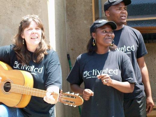 Talitha (L), Zanelle and  Mandla singing a local song