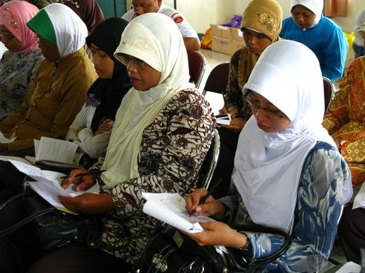 Teachers studying materials at the Jogja early learning seminar.