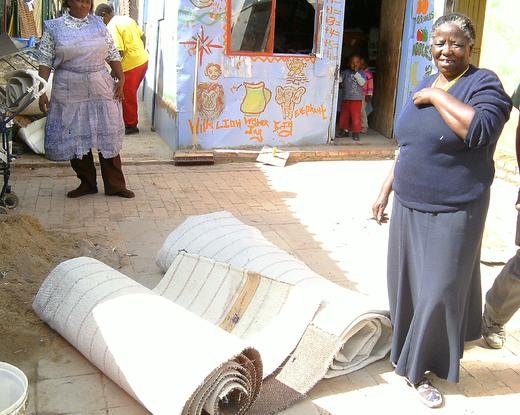 Underprivileged Cr&egrave;che in Diepsloot happily receiving donated fitted carpet
